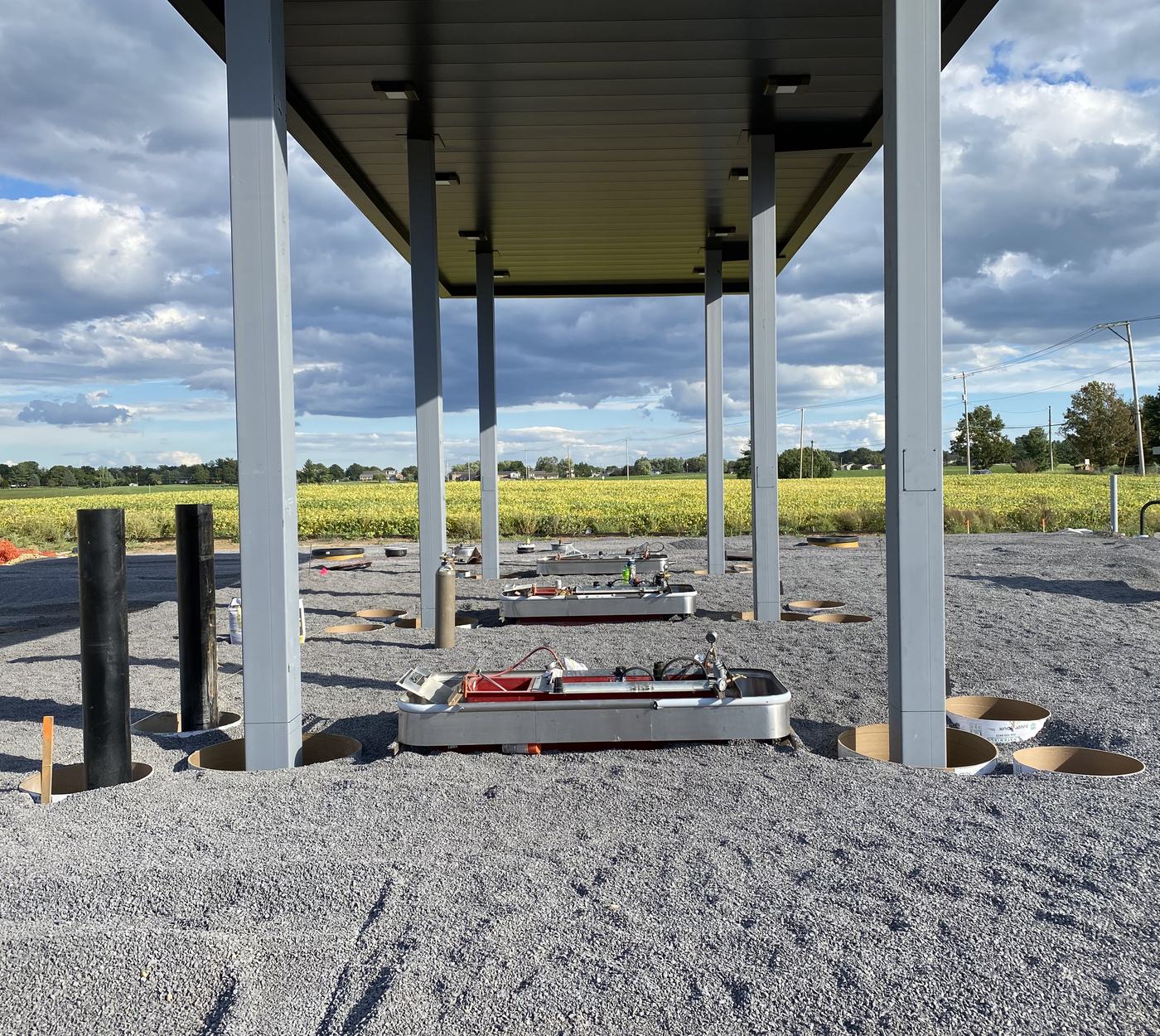 Dispenser islands and sumps set under a new fuel canopy