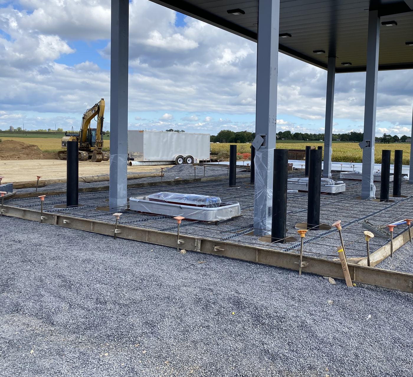 Island forms and rebar laid under a new fuel canopy