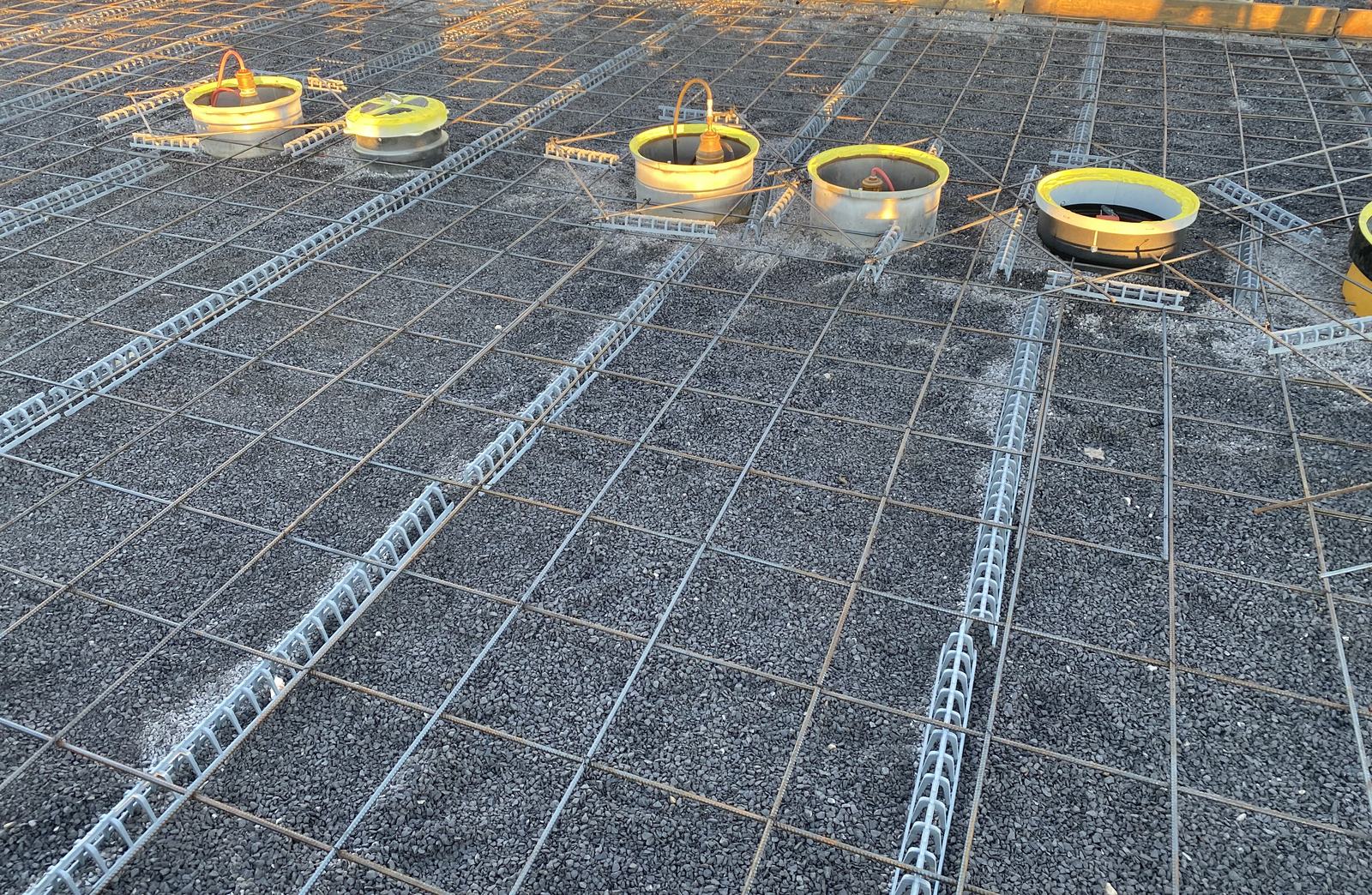 Rebar mat and manway rings set before the tank pad concrete pour