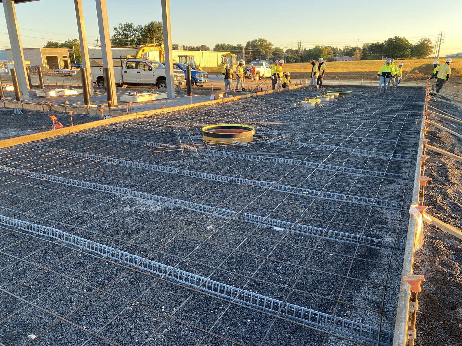 Wide view of a rebar-matted tank pad ready for concrete