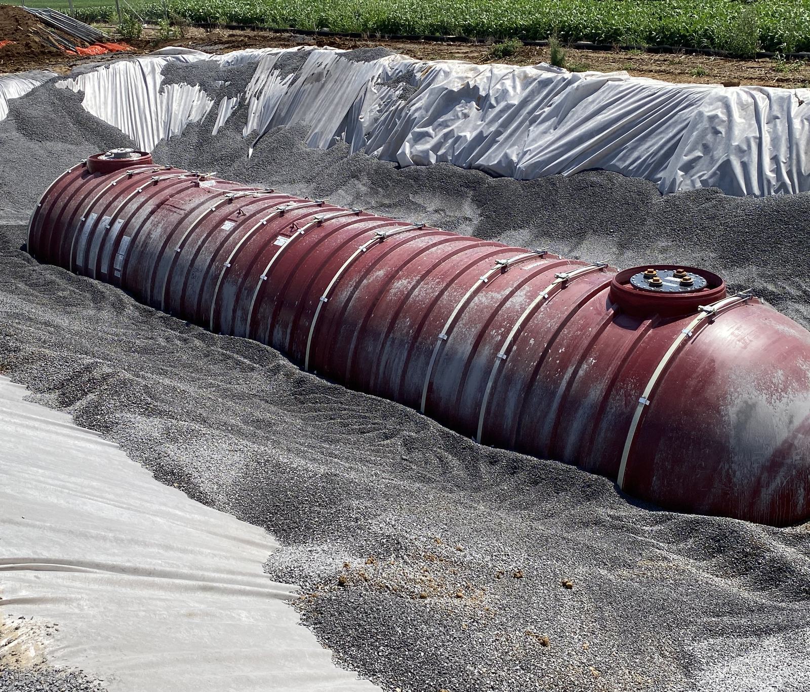 Pea-gravel backfill brought up around an underground storage tank